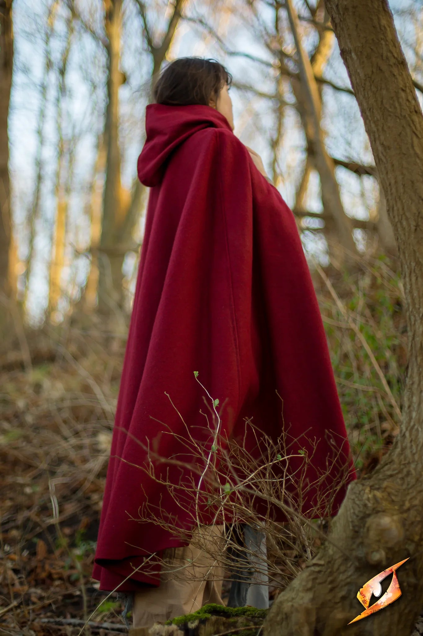 Cape Wool worn by a person in a forest, showcasing the heavy, water-tight fabric and deep hood.