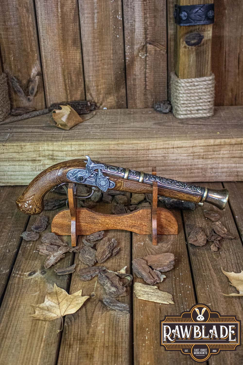 Thunder Gun displayed on wooden stand with autumn leaves, showcasing its detailed craftsmanship and vintage design.