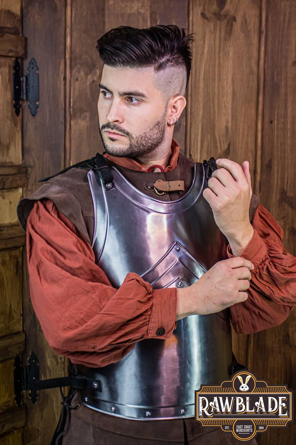 Model wearing the Alonso Cuirass, an iron armor piece with leather straps and buckles from Rawblade.