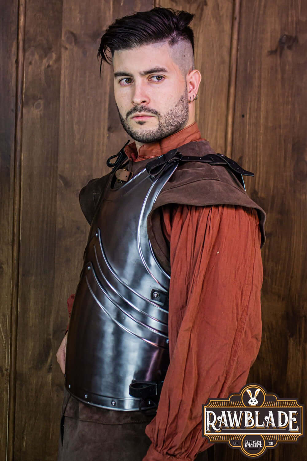 Alonso Cuirass by Rawblade showcased on a model, featuring a polished iron breastplate and leather straps.
