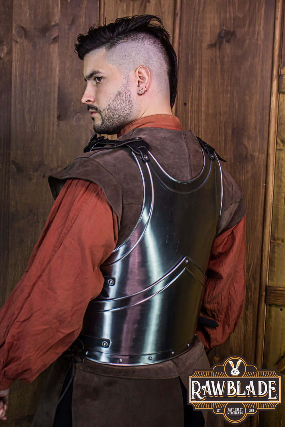 Alonso Cuirass displayed on a model, showcasing its iron breastplate and leather straps.