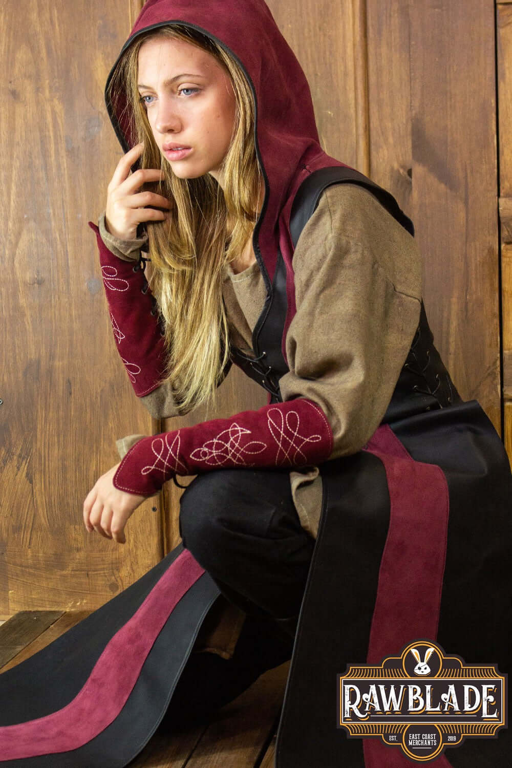 Arylith Archer Leather Tunic featuring a fitted cut and wide hood, elegantly crafted from premium leather.