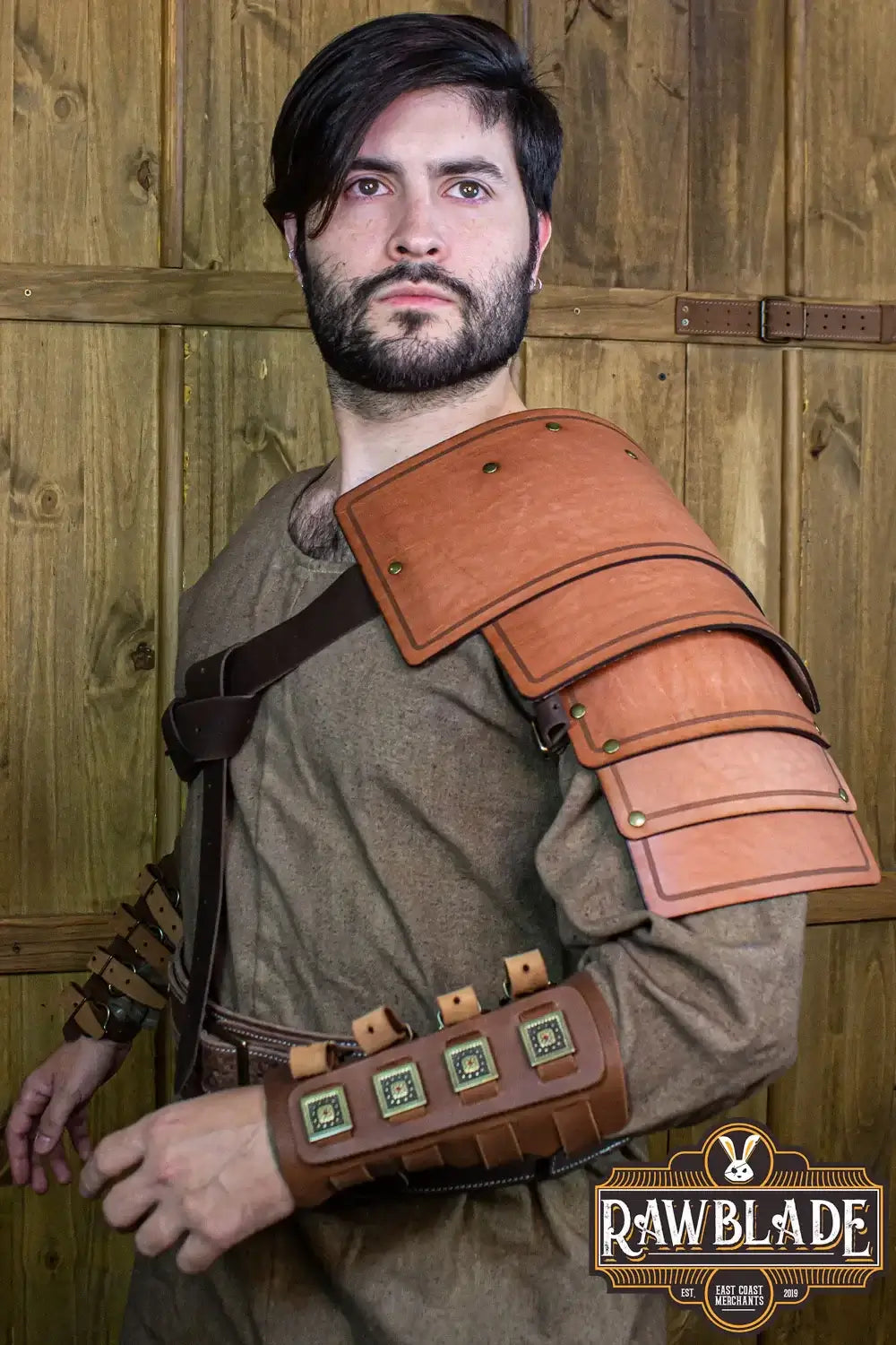 Adventurer Shoulder pad worn by a man, showcasing aged leather design for adventurers.