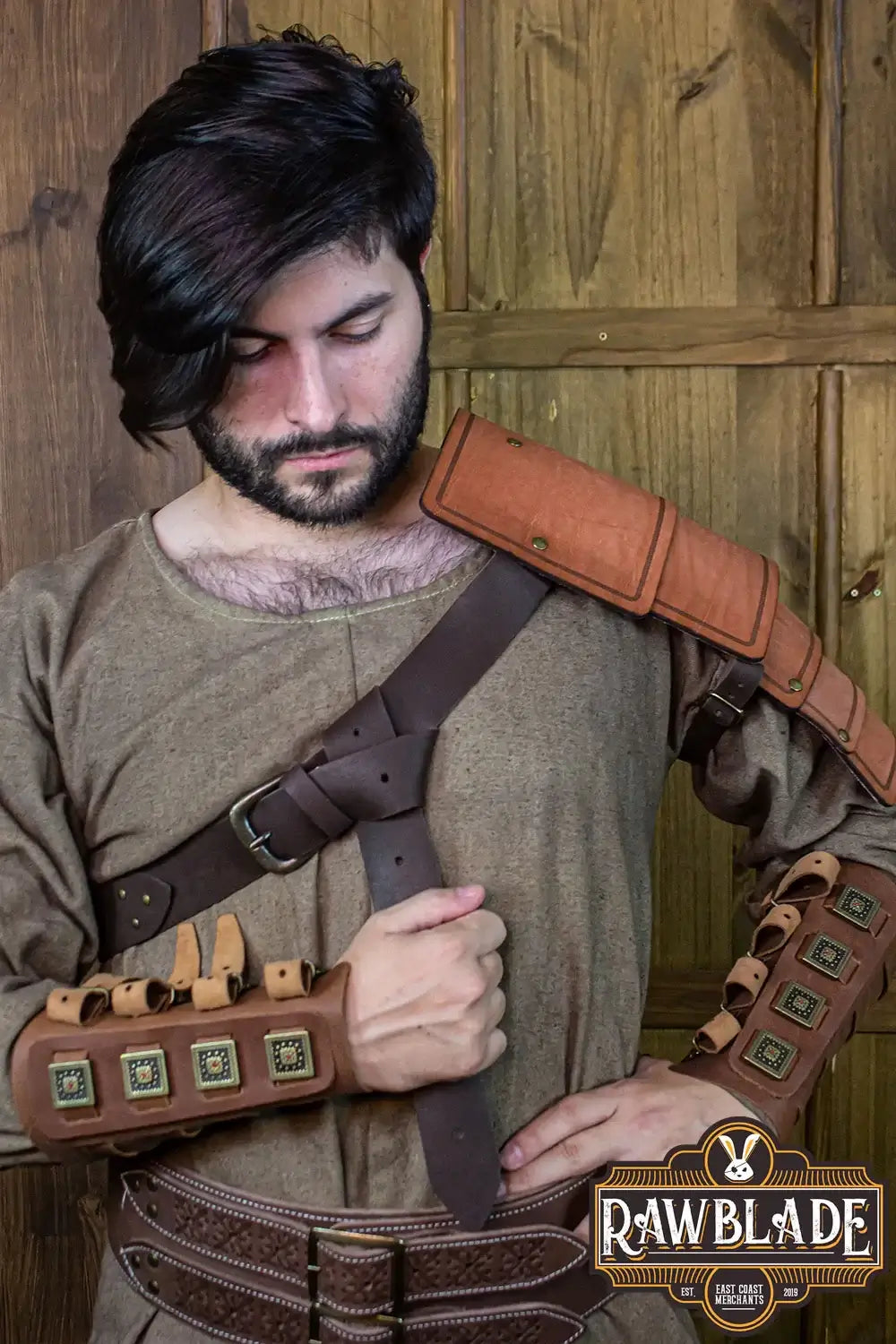 Man wearing Adventurer Shoulder pad made of aged leather, perfect for enhancing safety during adventures.