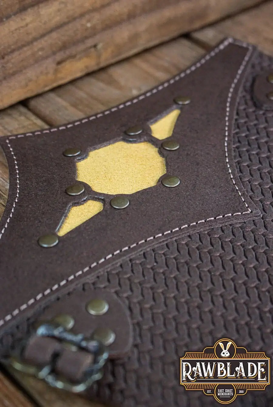 Beljant Bracer detail featuring leather texture, buckles, and colorful diamond insert for customizable style.