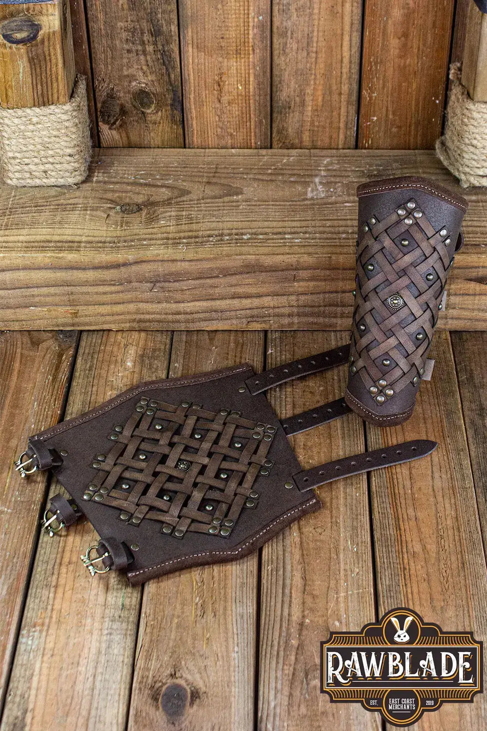 Brawley Studded Bracelets displayed on a wooden surface, showcasing their leather design and riveted detail.