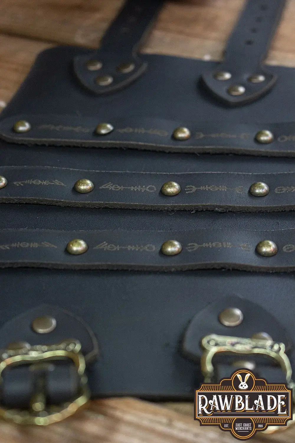 Hirdman Bracers close-up of leather straps with studs and buckles for historical reenactments and LARP.