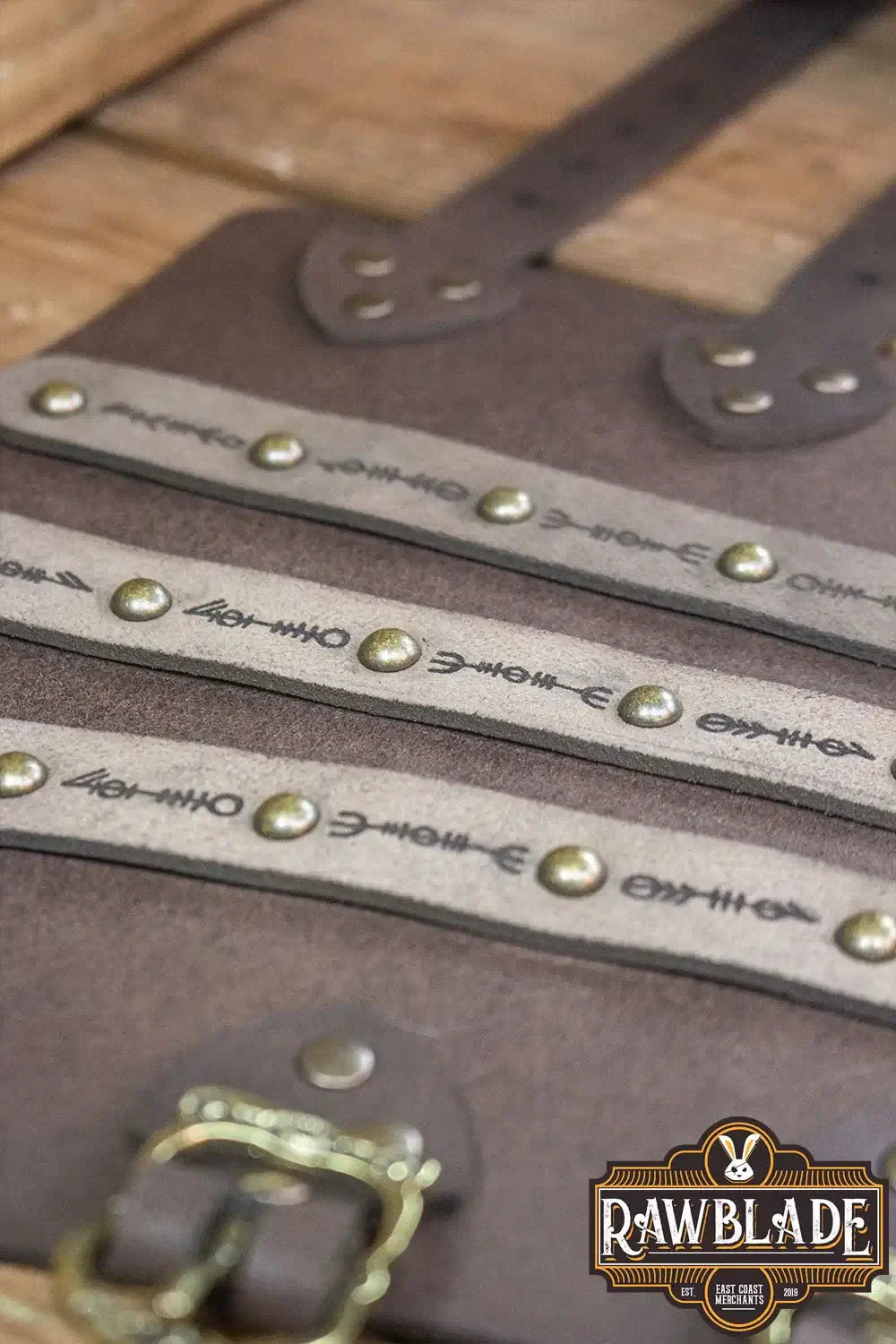 Hirdman Bracers leather bracelets with engraved straps and studs for historical recreation and LARP events.