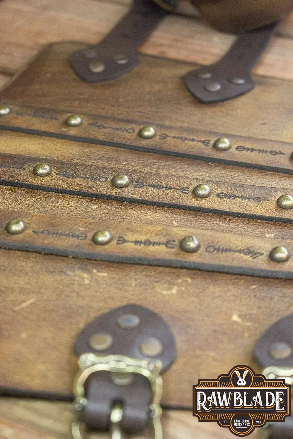 Hirdman Bracers with engraved leather straps and studs for historical recreation and LARP events.
