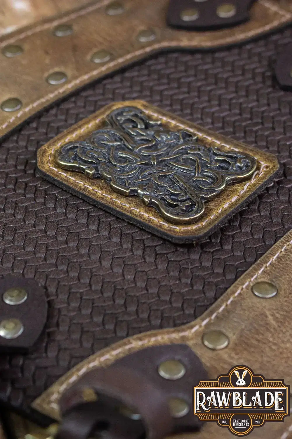 Close-up of Bruce Bracers featuring intricate design, quality leather, and secured with rivets for durability.