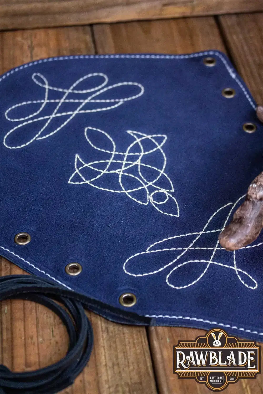 Vryla Premium Bracers showing intricate designs on rich blue leather, ideal for light fighters.
