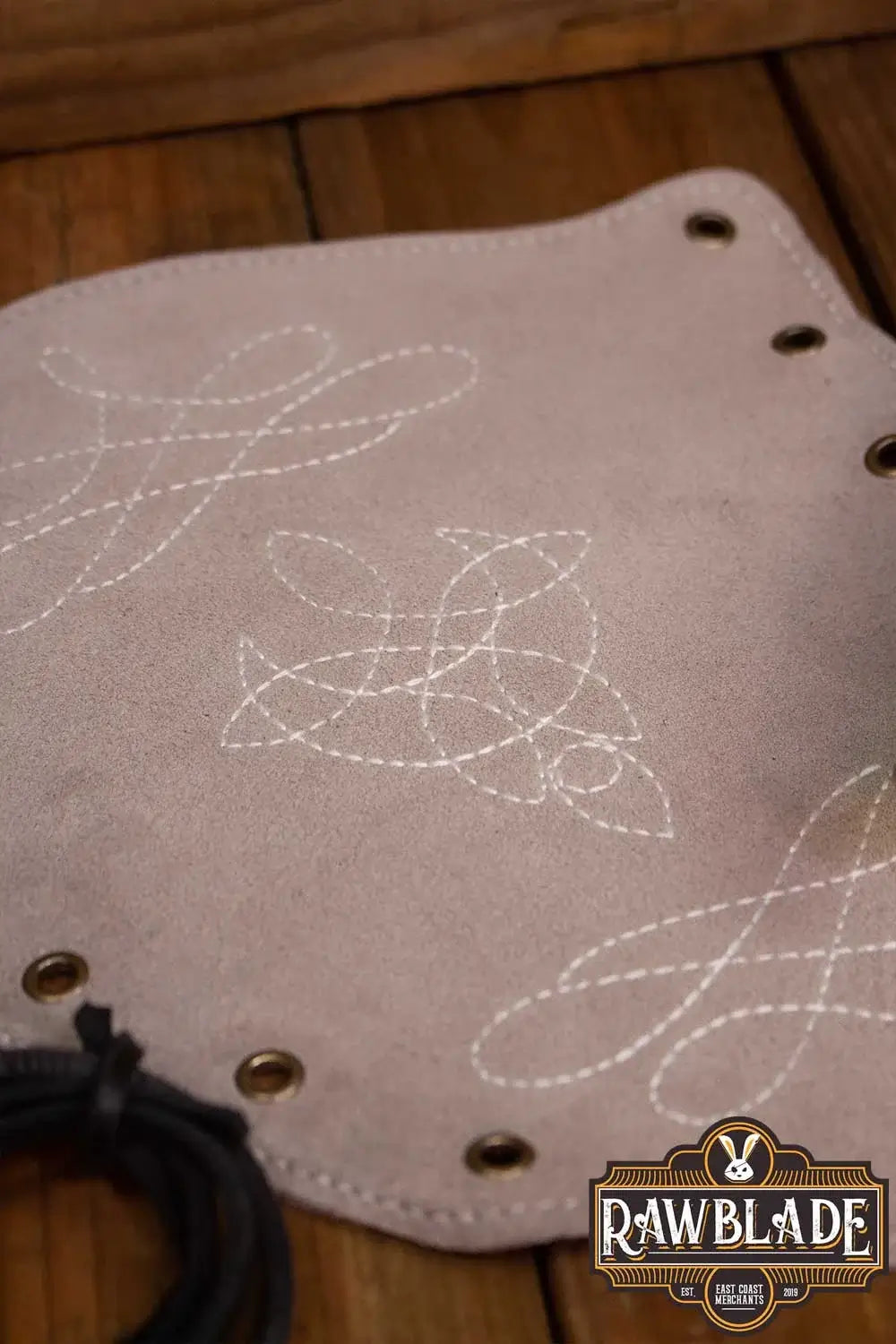 Vryla Premium Bracers in light leather with intricate stitching and eyelets, perfect for light fighters.