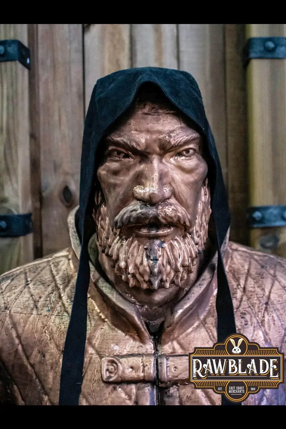Barbadok Leather Coif displayed on a sculpted figure, showcasing its craftsmanship and design.