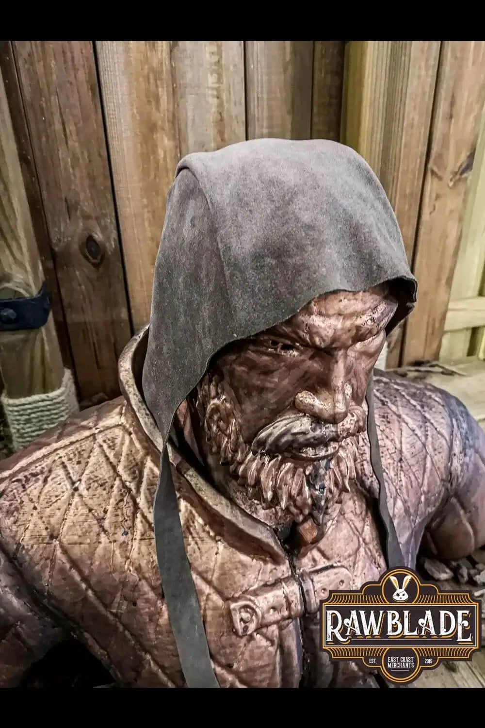 Barbadok Leather Coif displayed on a statue, showcasing its high-quality split leather and unique design.
