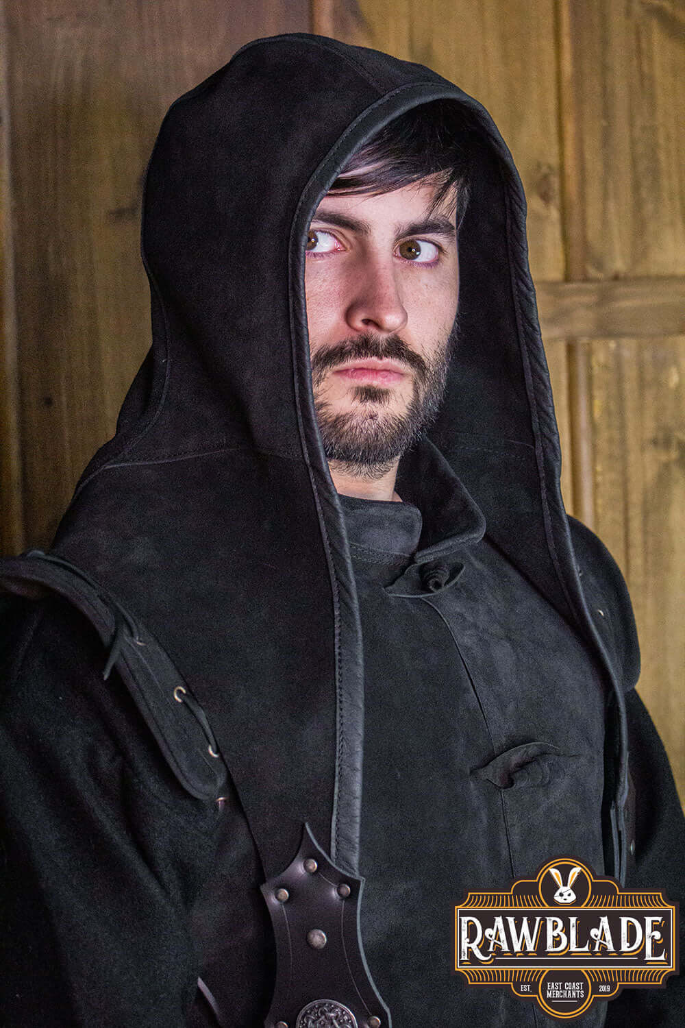 Man wearing an Akku Splitleather Hood with metal ornaments, showcasing its elegant design and dark aesthetic.