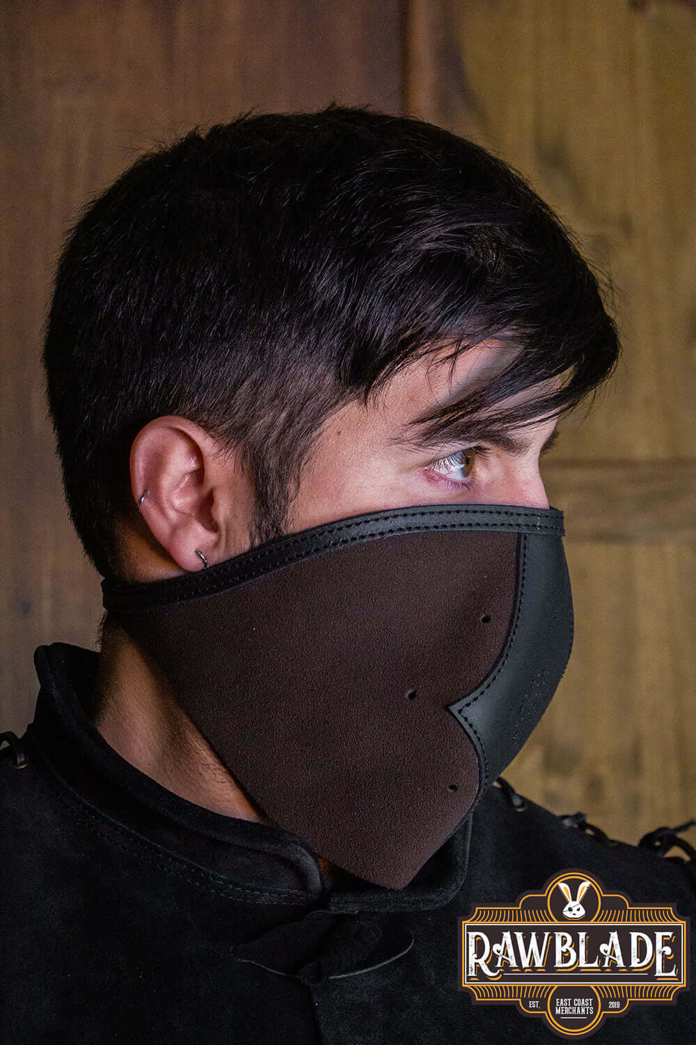 Close-up of a person wearing an Akku Splitleather Hood and mask, showcasing the design and materials.