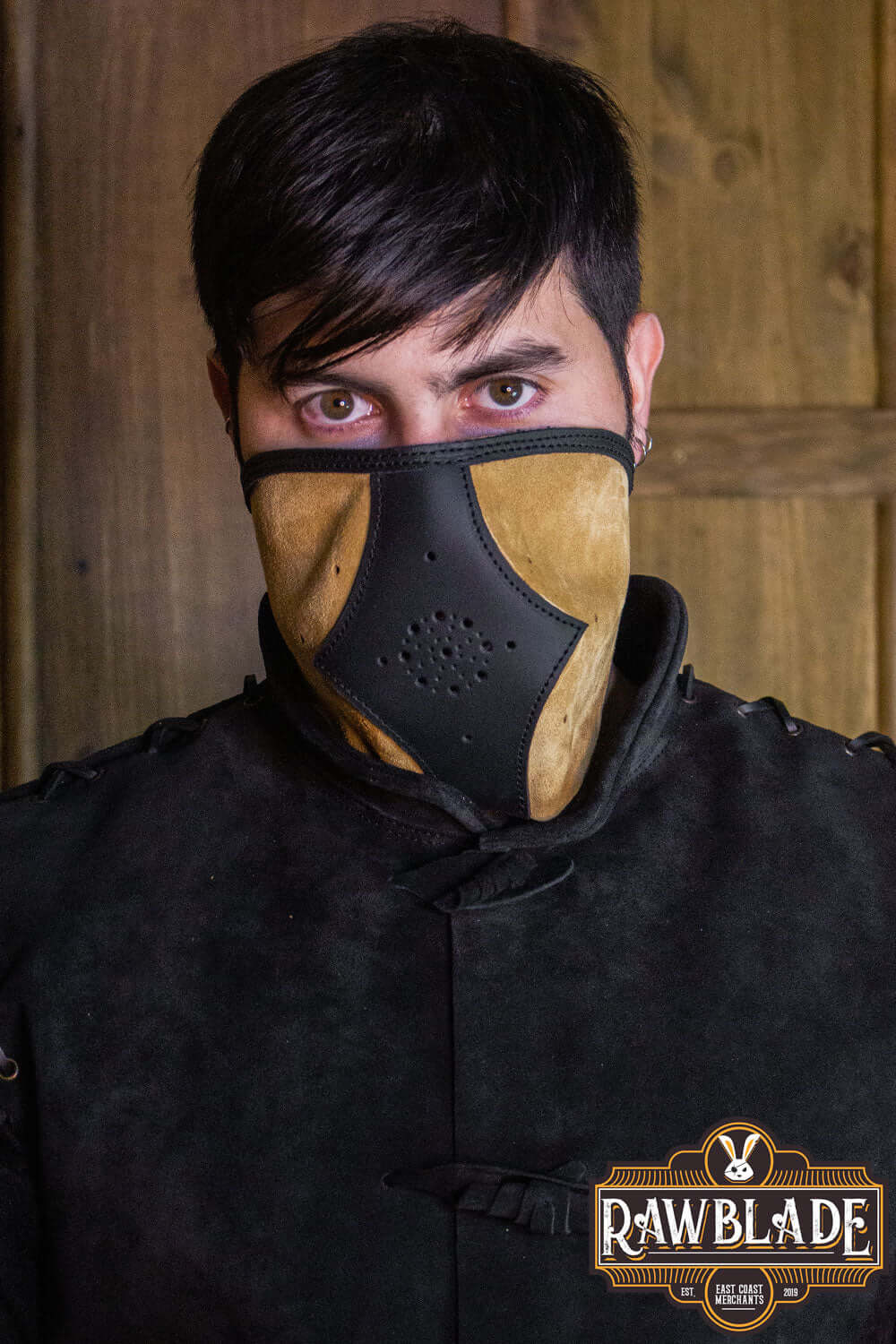Akku Splitleather Hood worn by a model, showcasing its unique design and leather reinforcements.