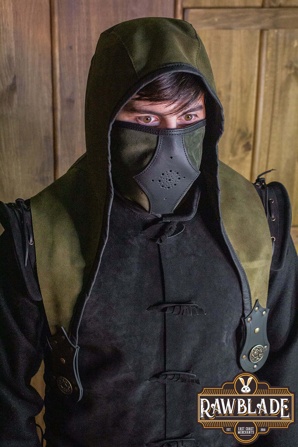 Model wearing the Akku Splitleather Hood with leather reinforcements and mask, showcasing its elegant design.