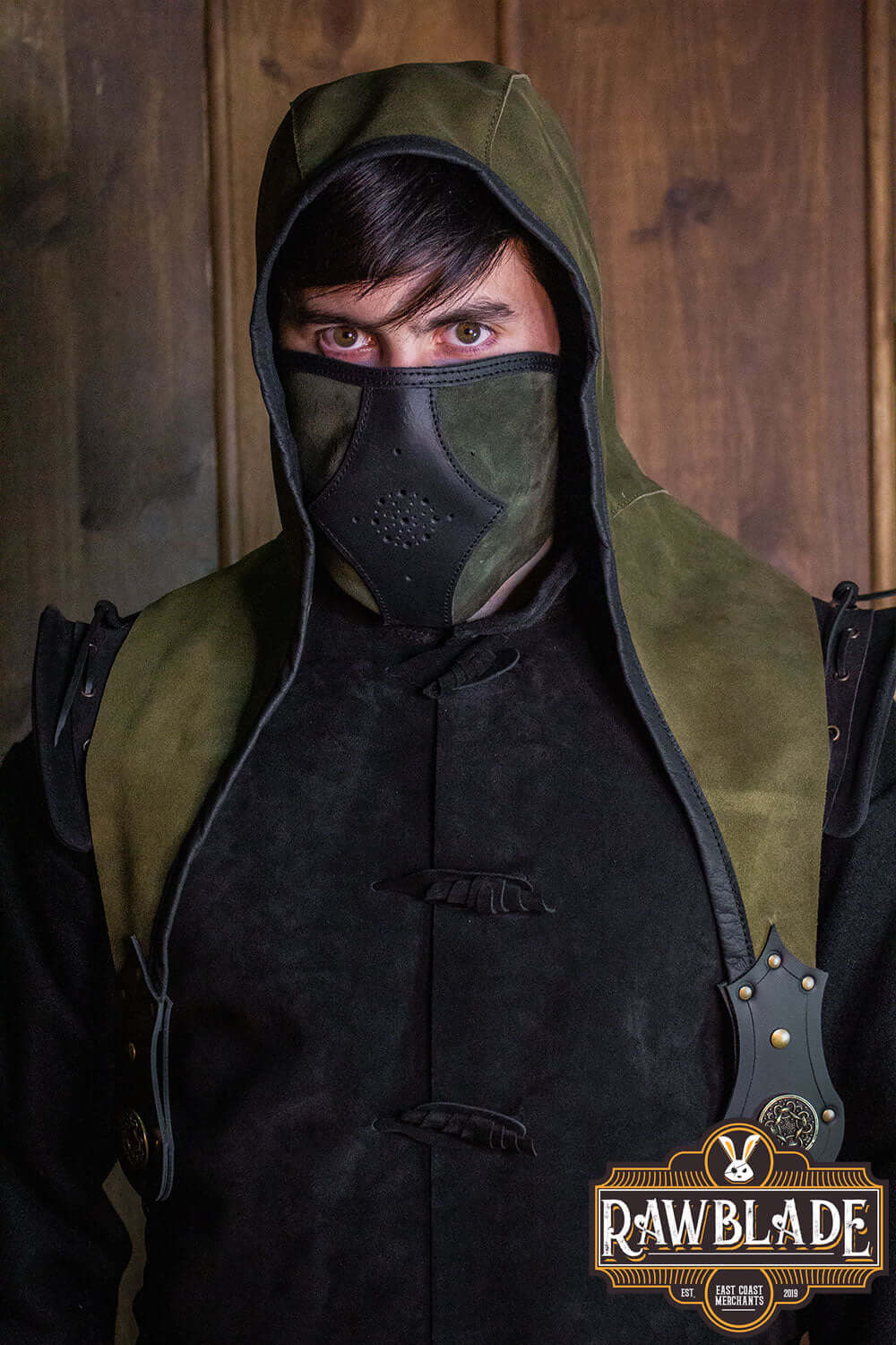 Model wearing an Akku Splitleather Hood with mask, showcasing its unique design and craftsmanship.