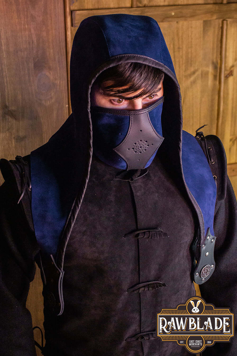 Akku Splitleather Hood worn by a character, featuring leather reinforcements and elegant metal ornaments.