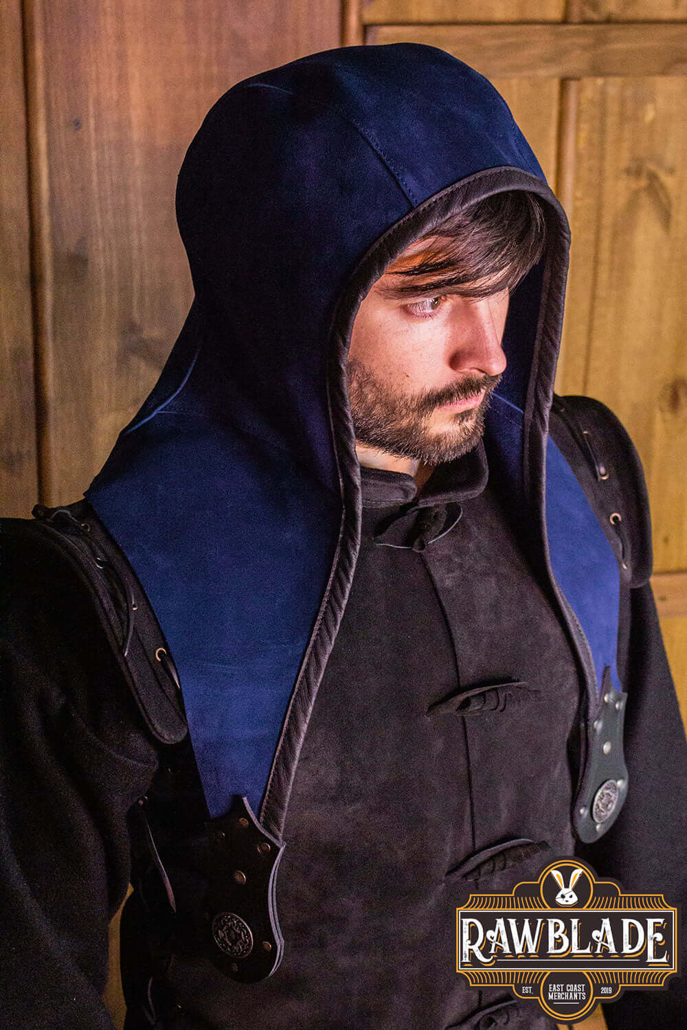 Akku Splitleather Hood worn by a man in a medieval-style outfit with leather accents, showcasing the elegant design.