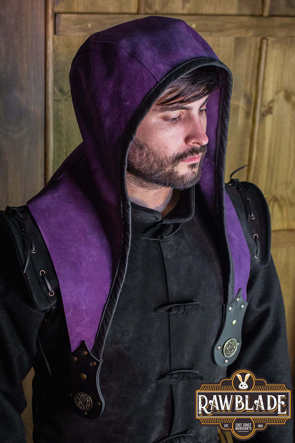 A man wearing the Akku Splitleather Hood with a stylish purple finish and leather reinforcements.
