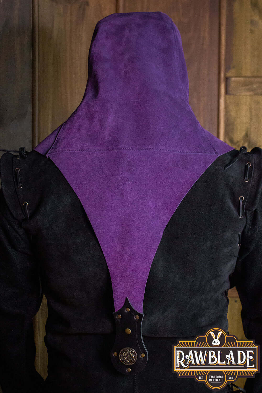 Rear view of the Akku Splitleather Hood showcasing its unique purple design and elegant structure.