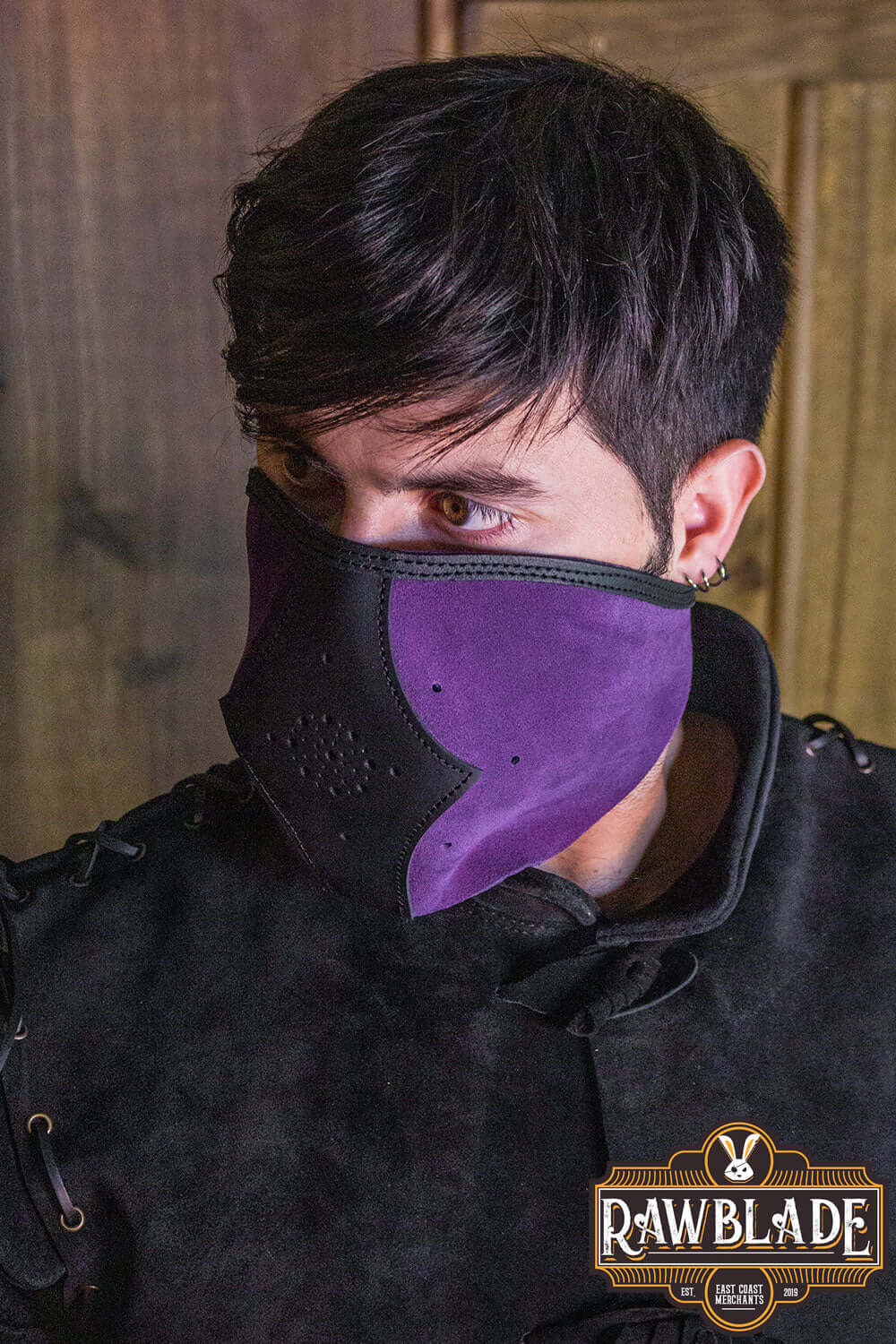 Akku Splitleather Hood worn by a character, featuring a purple mask and detailed leather reinforcements.