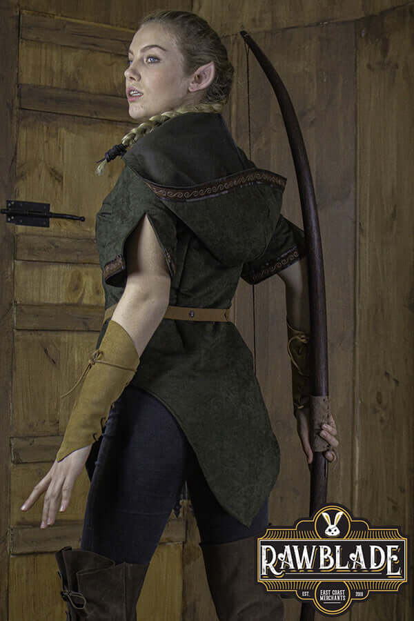 Model wearing Briannan Ranger Tunic Suede with a wide hood and short sleeves, showcasing quality suede and leather trim.