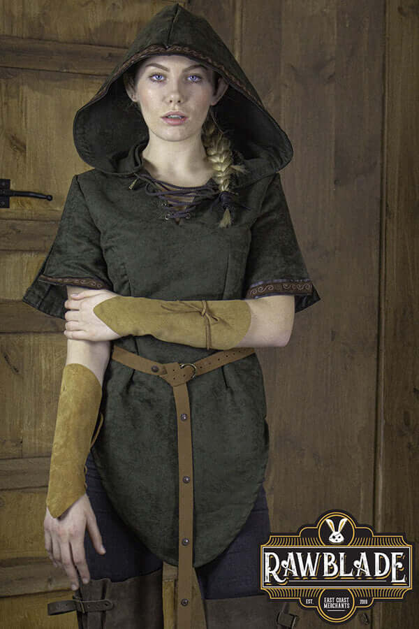 Briannan Ranger Tunic Suede worn by a model, featuring a hood and short sleeves, showcasing detailed leather trims.