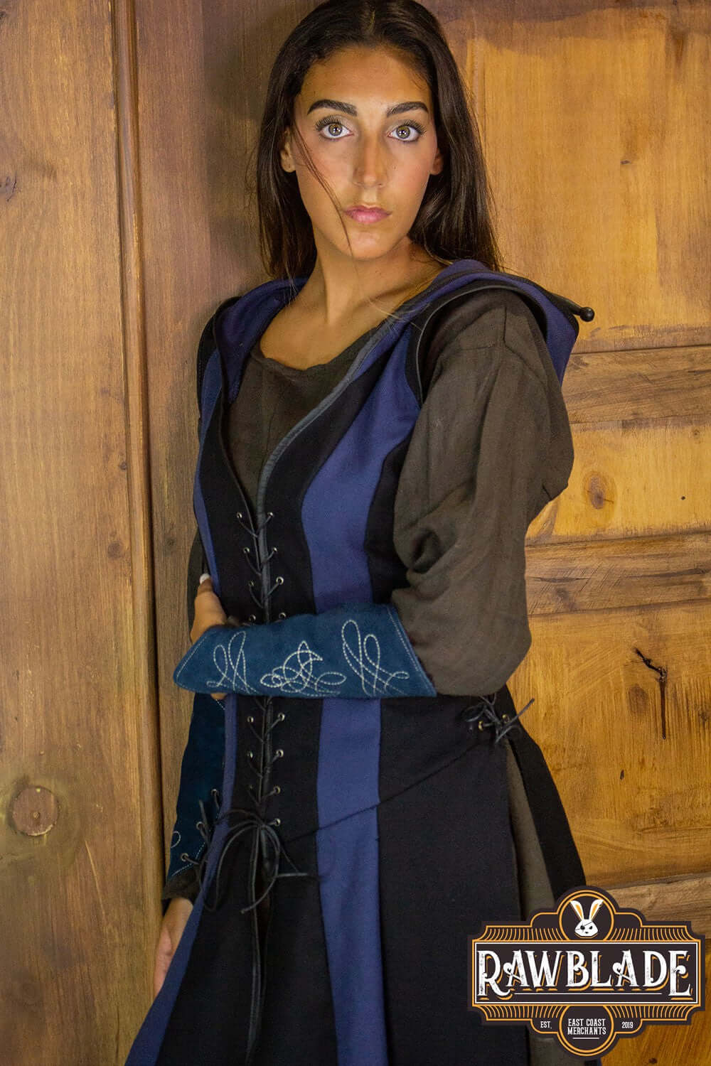 Arylith Archer Cotton Tunic showcased on a model, featuring a fitted design and adjustable drawstrings.