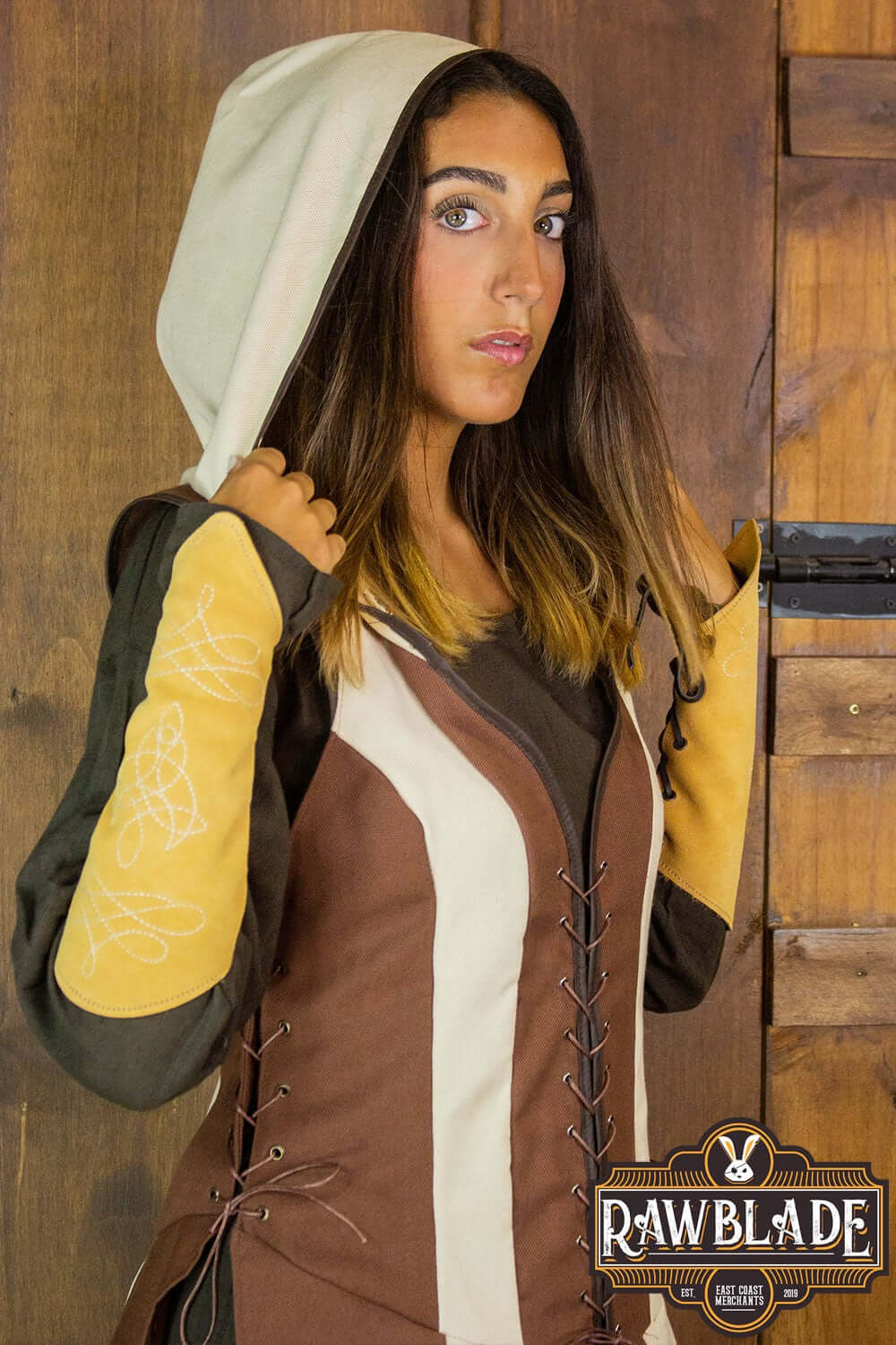 Arylith Archer Cotton Tunic featuring a fitted design, adjustable drawstrings, and elegant wide hood.