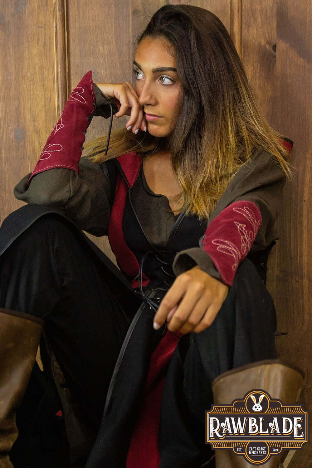Woman wearing the Arylith Archer Cotton Tunic by Rawblade, featuring elegant design and adjustable drawstrings.