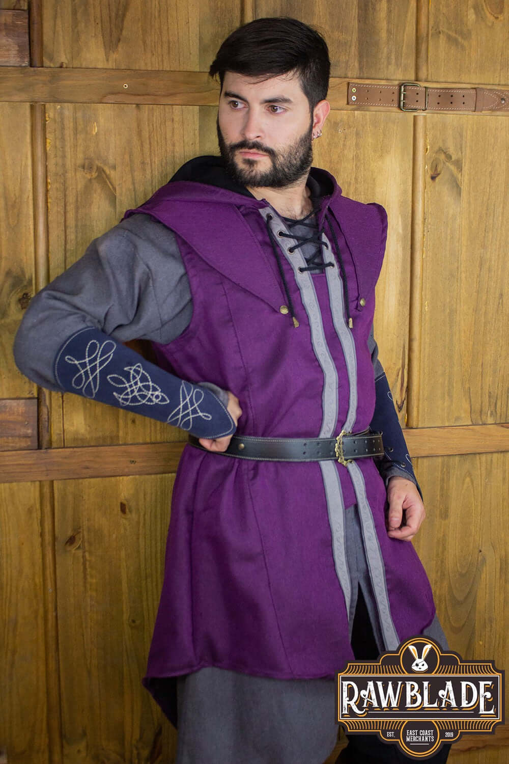 A model wearing the Karanthir Tunic, showcasing its wide hood and stylish design, ideal for young wizards.