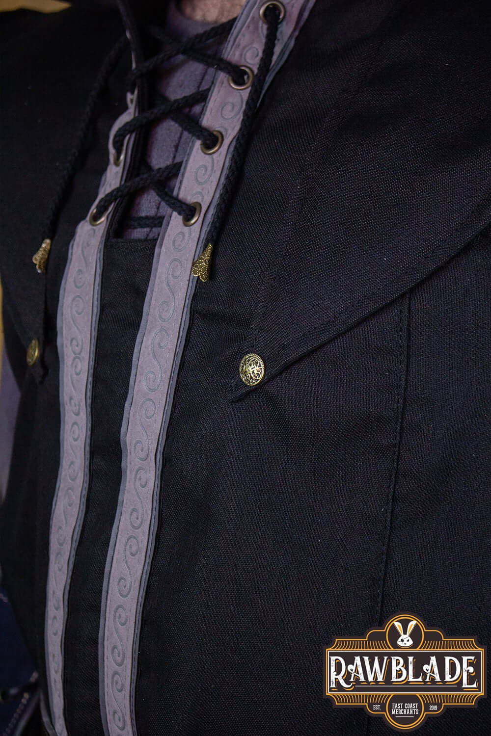 Close-up detail of the Karanthir Tunic showcasing its stylish hood and intricate lacing from Rawblade.