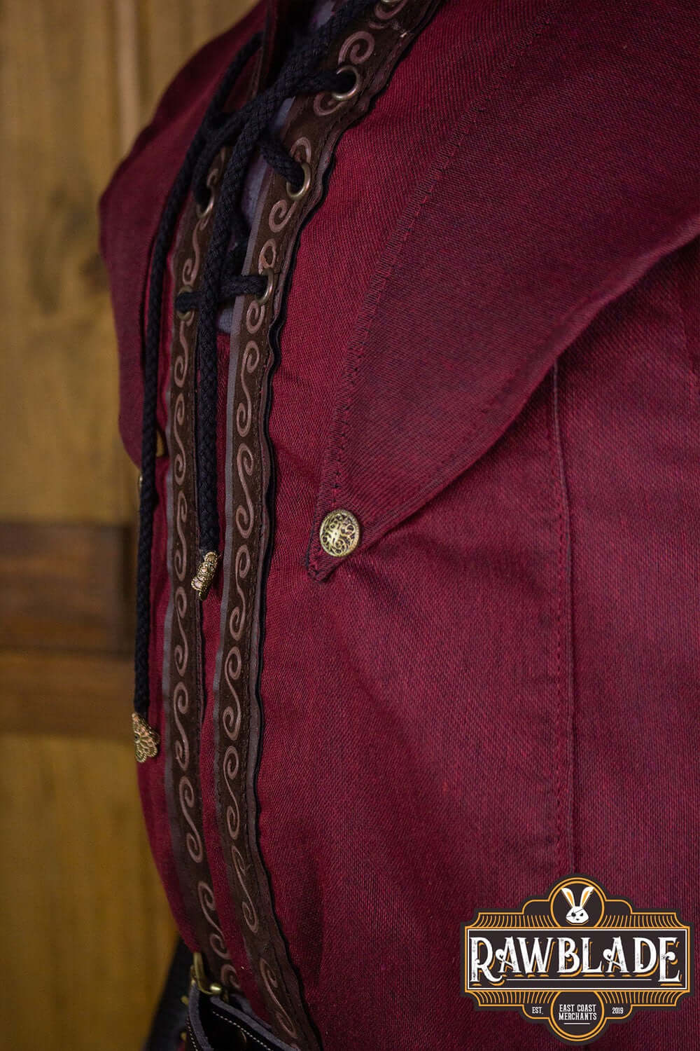 Karanthir Tunic featuring intricate detailing and a stylish hood for young wizards or elven trackers.