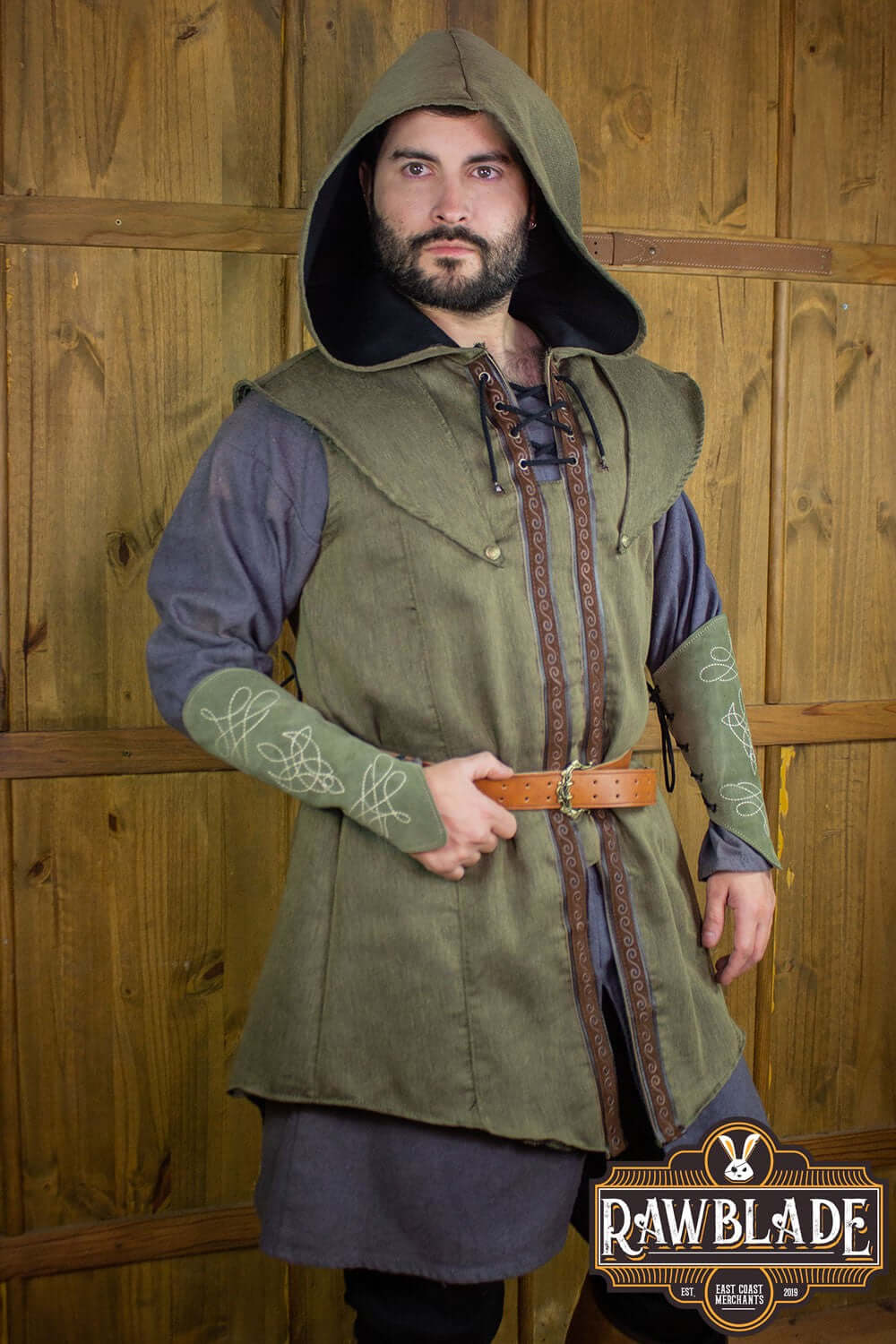 Model wearing the Karanthir Tunic from Rawblade, featuring a wide hood and stylish design for adventurers.