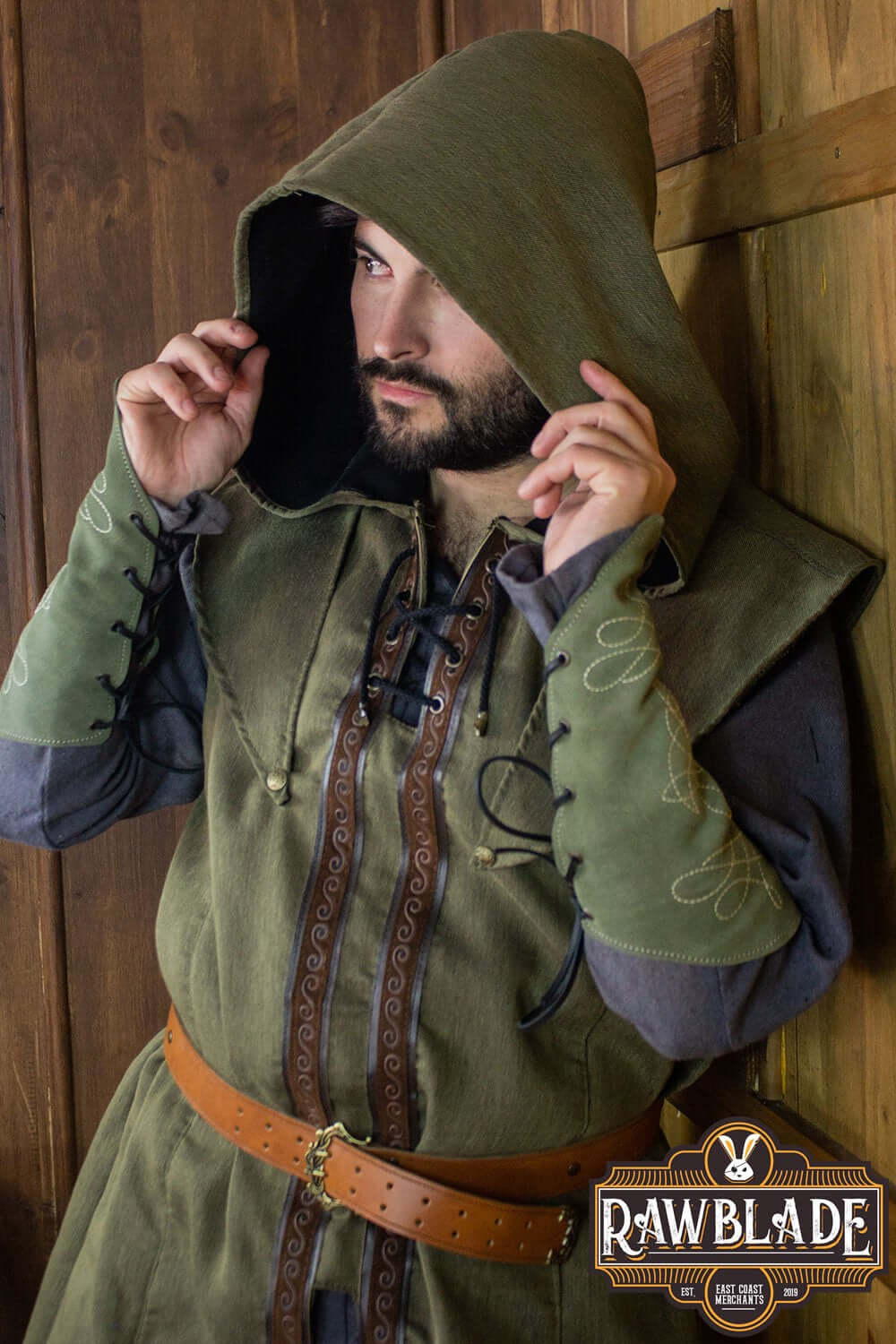 Model wearing Karanthir Tunic with hood from Rawblade, perfect for young wizards and elven trackers.