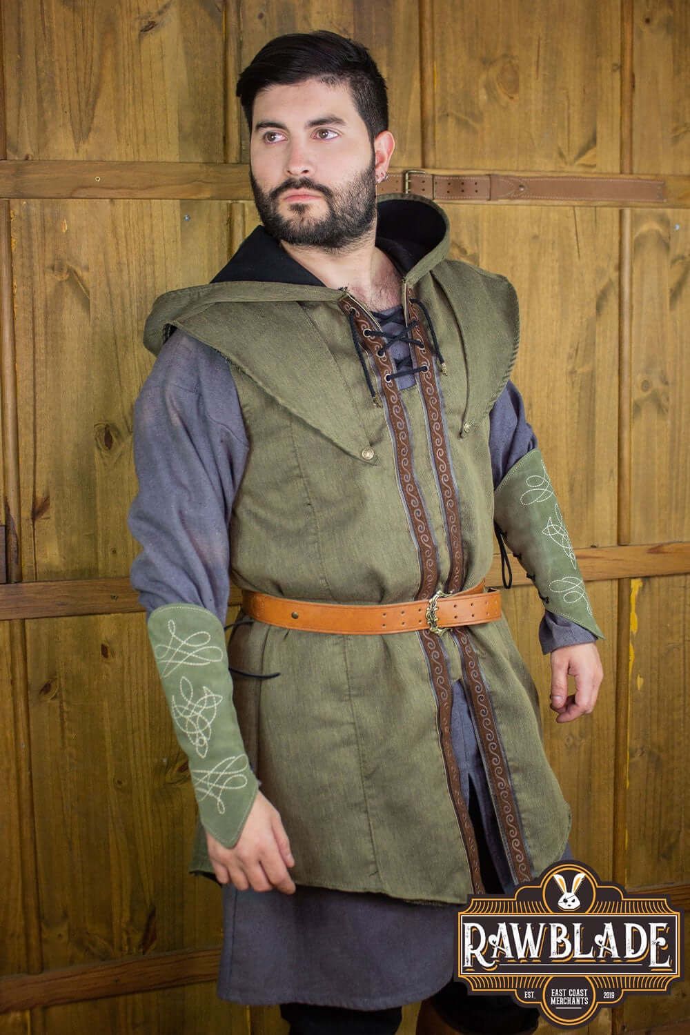 Model wearing Karanthir Tunic by Rawblade with a wide hood and stylish design.
