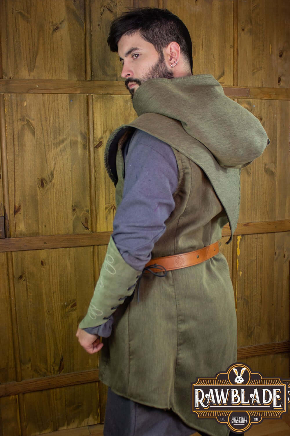 Back view of a man wearing the Karanthir Tunic with a hood and belt from Rawblade, designed for adventurers.