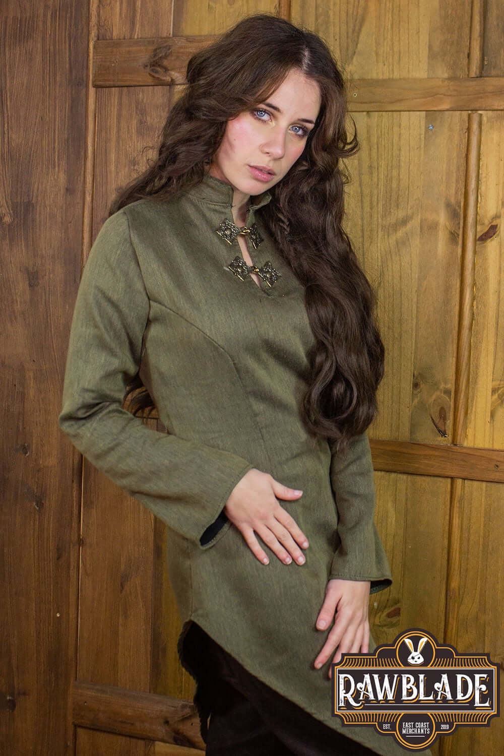 Astherii Tunic model wearing a stylish olive green tunic with flared sleeves, ideal for LARP enthusiasts.