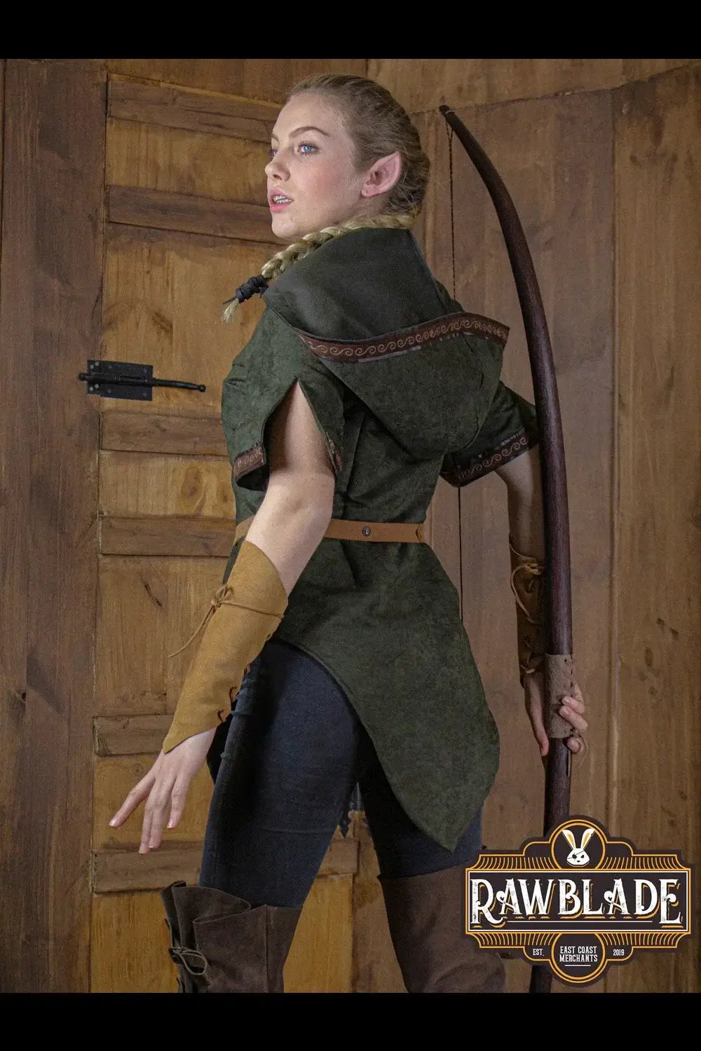 Model wearing Briannan Ranger Tunic Suede, showcasing its comfortable design with a wide hood and decorative trims.