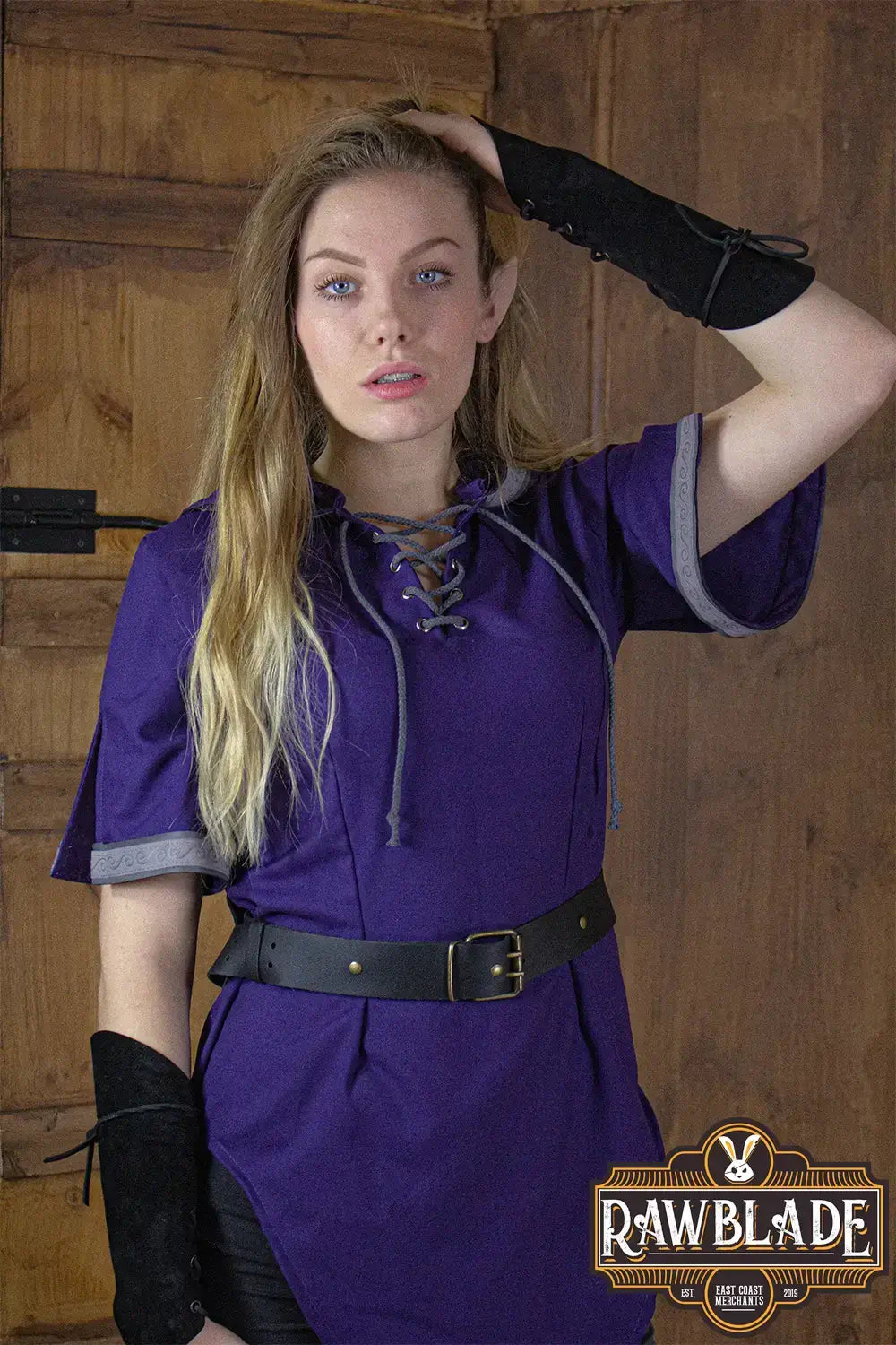 Briannan Ranger Tunic featuring a purple twill fabric, wide hood, and leather accents.