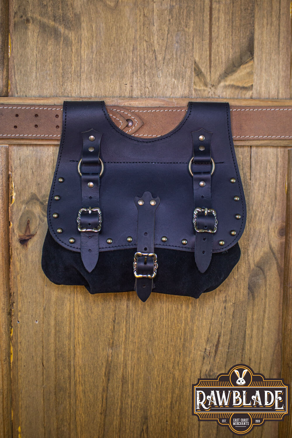 Agor Belt Bag made of leather and split leather, featuring stylish buckles and hanging from a belt.
