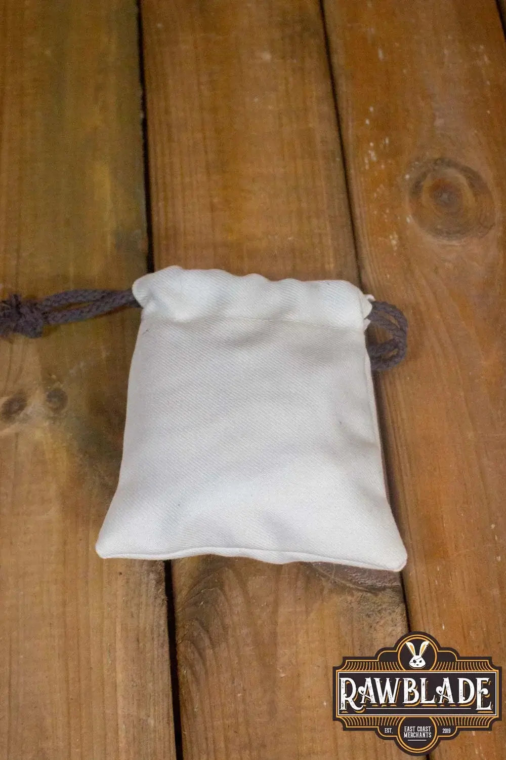 Timber Pouch Premium in thick cotton fabric resting on wooden surface.