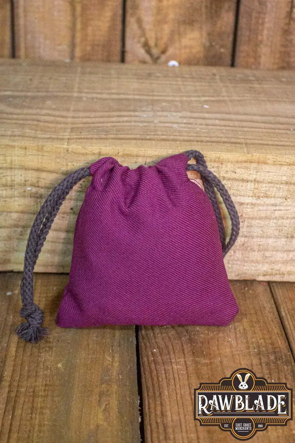 Timber Pouch Premium in maroon color with drawstring, showcasing high-quality cotton fabric craftsmanship.