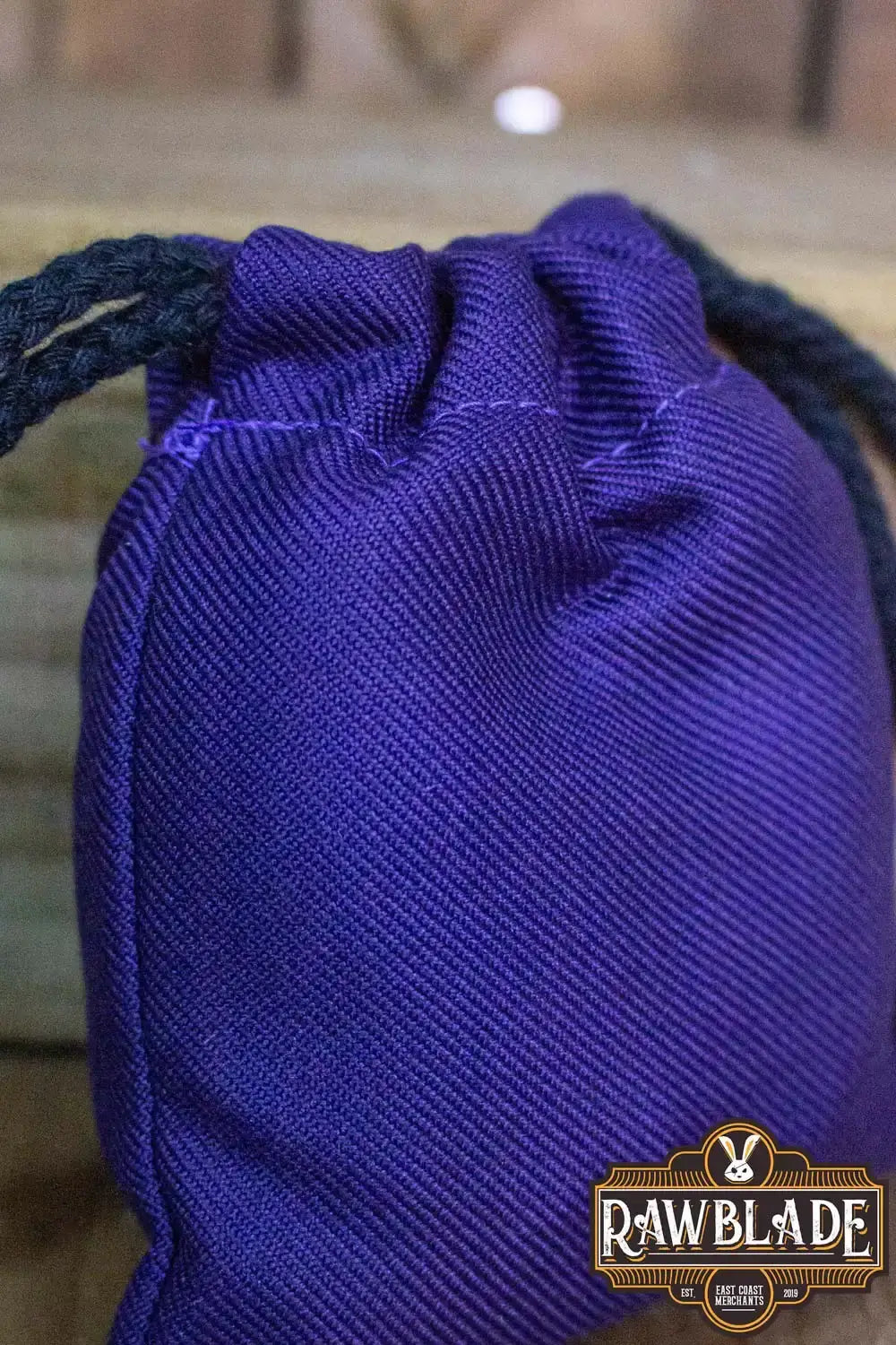 Timber Pouch Premium in purple fabric with drawstring closure, showcasing high-quality cotton craftsmanship.