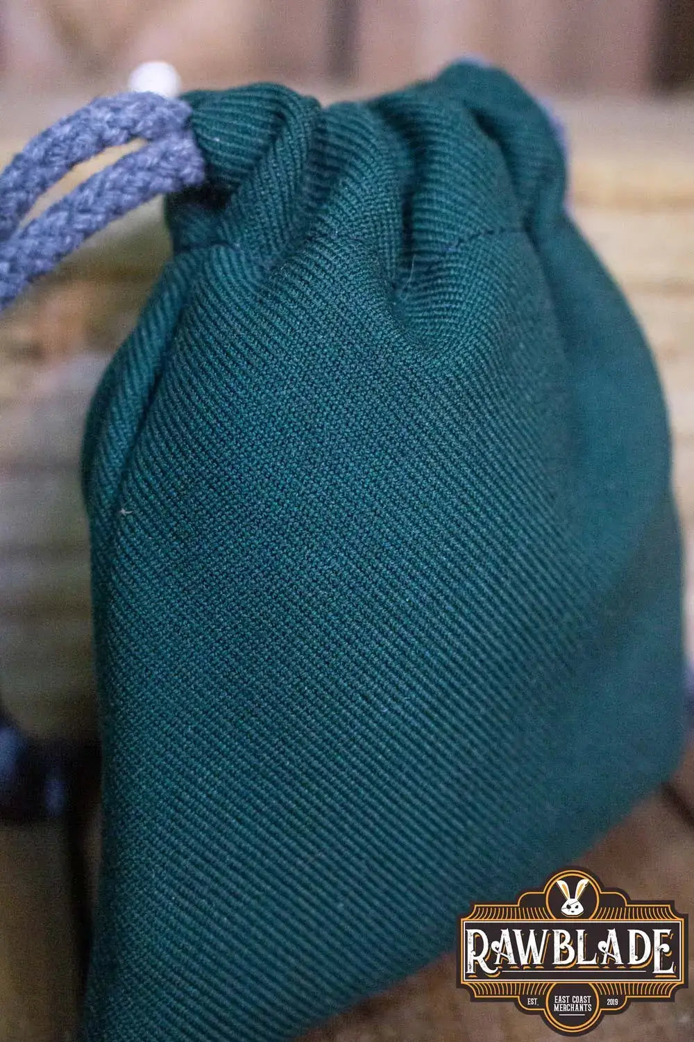 Timber Pouch Premium in deep green cotton with panama-style fabric and drawstring closure.