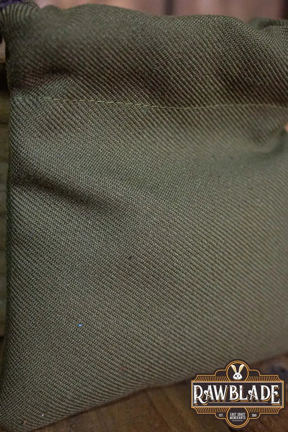 Timber Pouch Premium in olive green thick cotton fabric showcasing craftsmanship and quality.