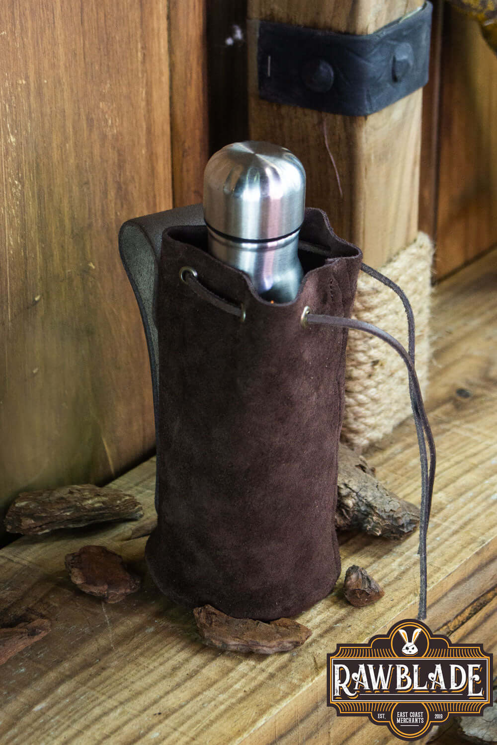 Adventurer Tube Pouch holding a metal flask, ideal for carrying beverages on adventures.